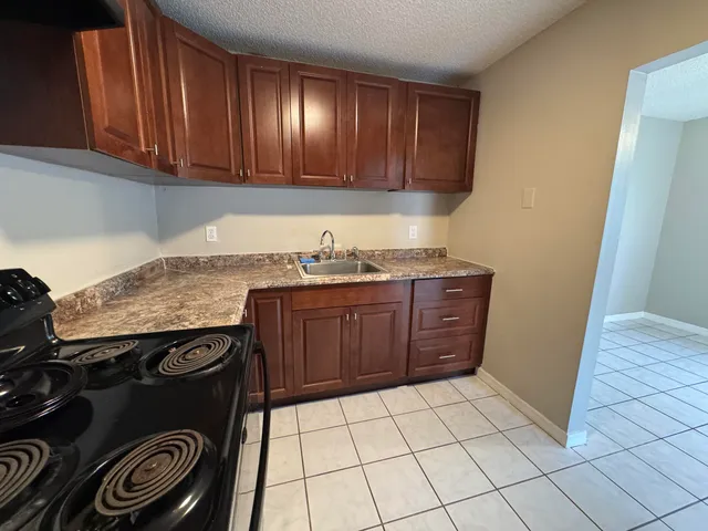 a kitchen with a cabinets and a stove