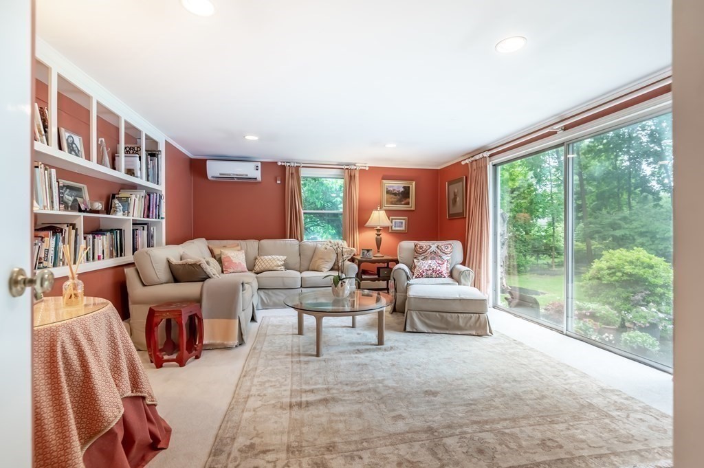 16 Hidden Road Andover, MA 01810 - Photo 15 of 42 a living room with furniture and a large window