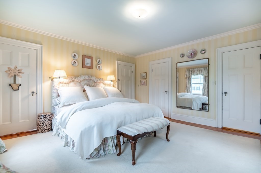 16 Hidden Road Andover, MA 01810 - Photo 19 of 42 a bedroom with a bed and a couch