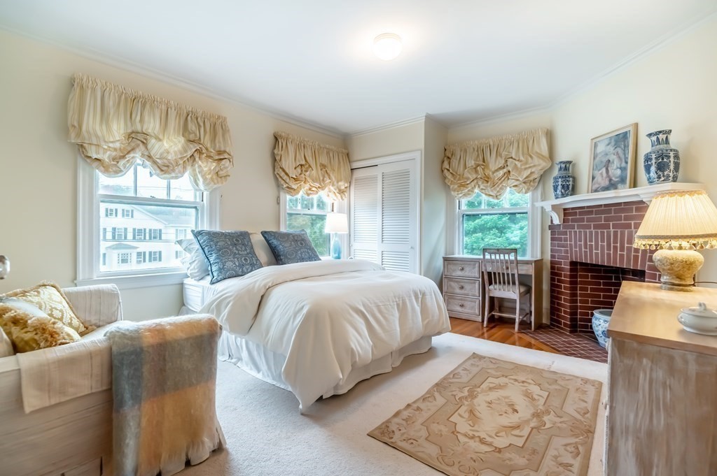 16 Hidden Road Andover, MA 01810 - Photo 22 of 42 a spacious bedroom with a bed and large windows