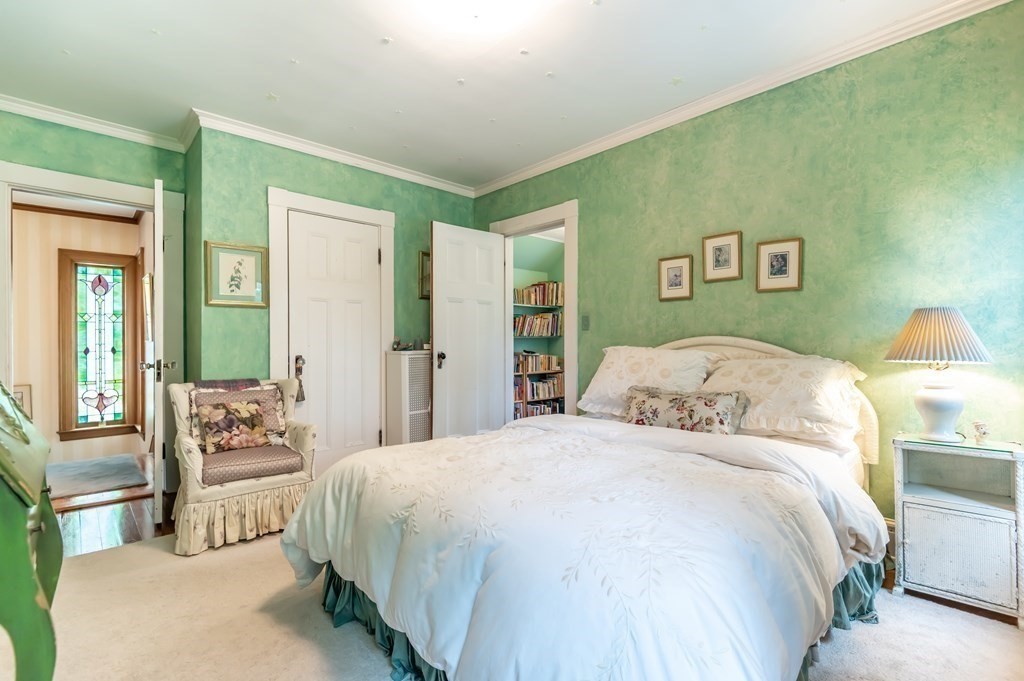 16 Hidden Road Andover, MA 01810 - Photo 25 of 42 a spacious bedroom with a bed and a couch