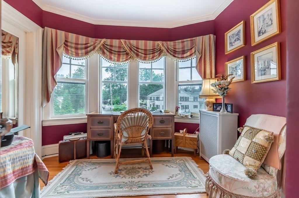 16 Hidden Road Andover, MA 01810 - Photo 27 of 42 a living room with furniture a rug and a large window