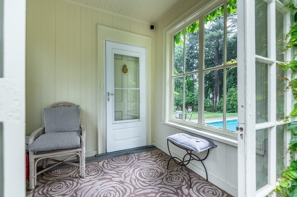 16 Hidden Road Andover, MA 01810 - Photo 33 of 42 a living room with furniture and a window