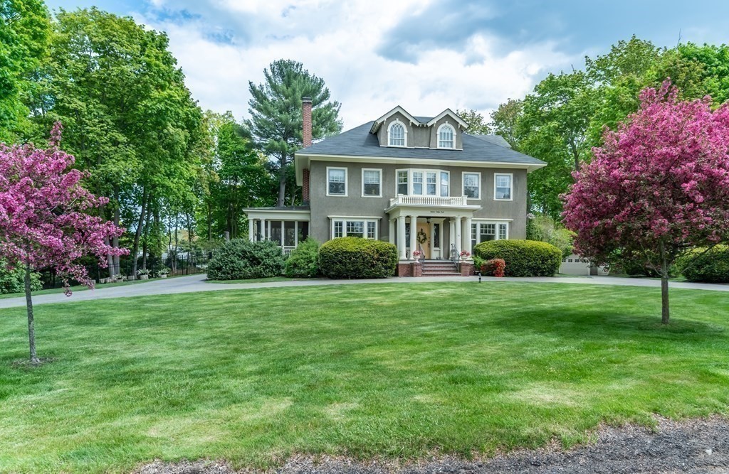 16 Hidden Road Andover, MA 01810 - Photo 37 of 42 a front view of a house with a garden