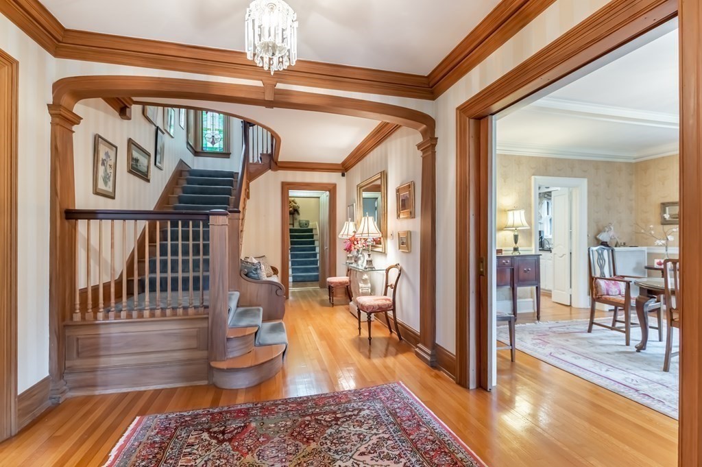 16 Hidden Road Andover, MA 01810 - Photo 4 of 42 a view of a livingroom with furniture wooden floor a chandelier