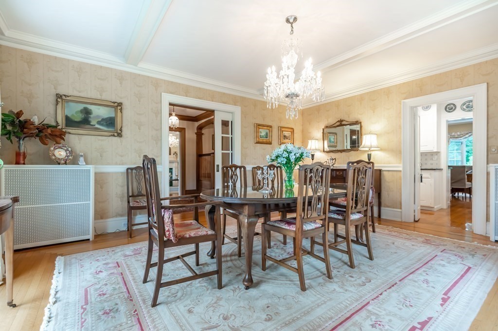 16 Hidden Road Andover, MA 01810 - Photo 8 of 42 a view of a dining room with furniture and chandelier