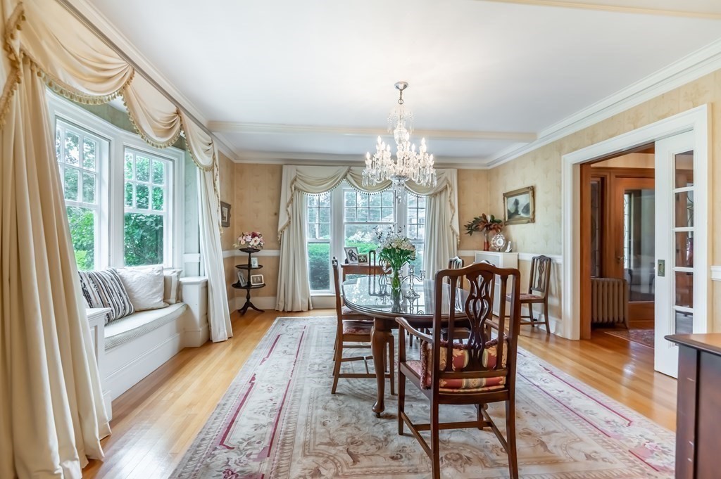 16 Hidden Road Andover, MA 01810 - Photo 9 of 42 a view of a dining room with furniture a chandelier and wooden floor