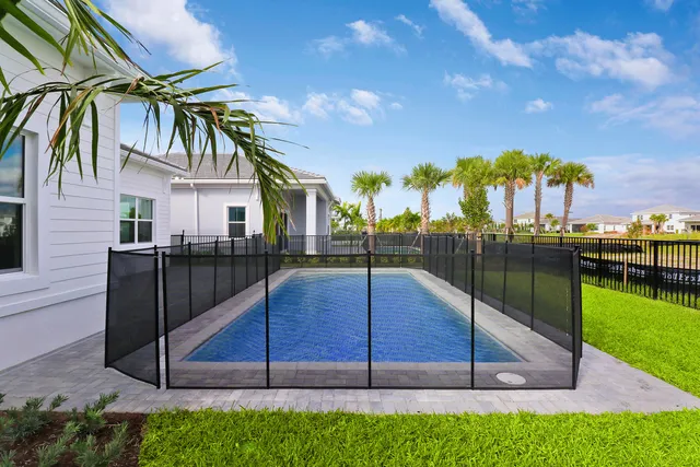 a view of a swimming pool with a lounge chairs