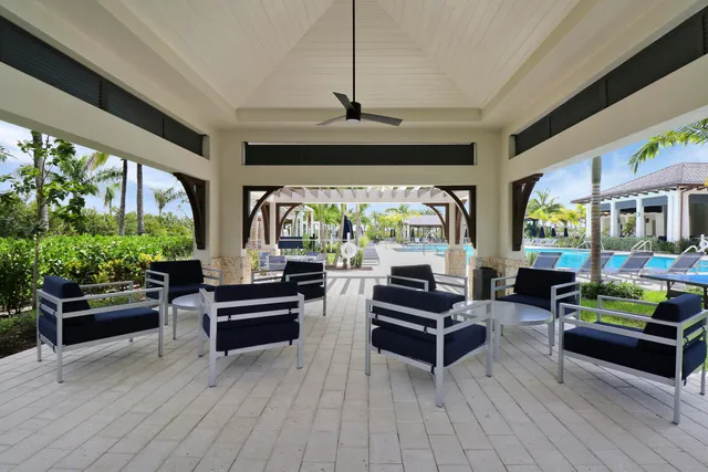 an aerial view of a house with garden space and lake view