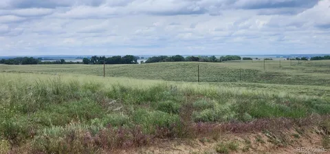 a view of an ocean and a yard