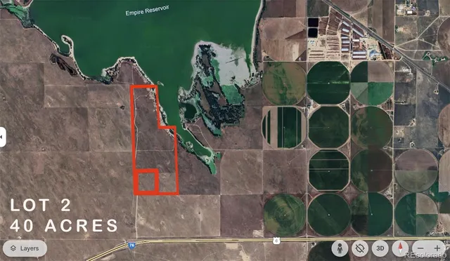 an aerial view of a house with backyard