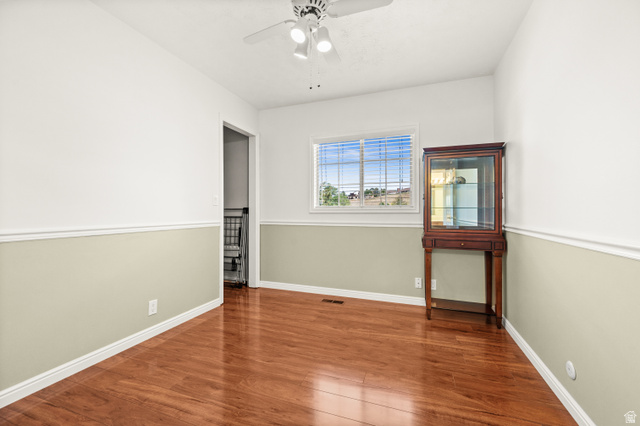 1650 Nichole Circle Sandy, UT 84093 - Photo 19 of 31 Interior room featuring wood-finish flooring, a white ceiling, and a ceiling fan with light fixture