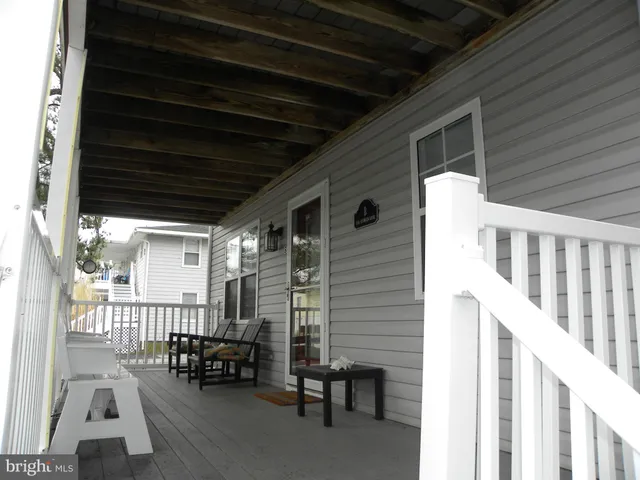 a view of a porch with furniture