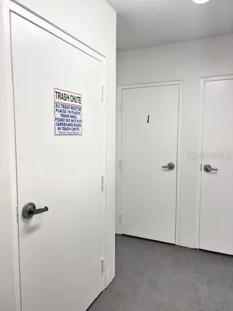 a view of swimming pool with outdoor seating and city view