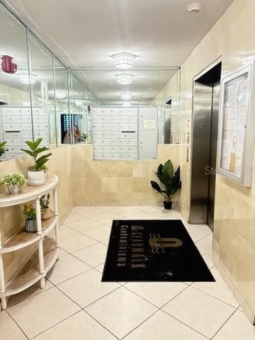 a front view of a house with a garden and parking