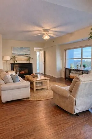 a living room with furniture and a fireplace