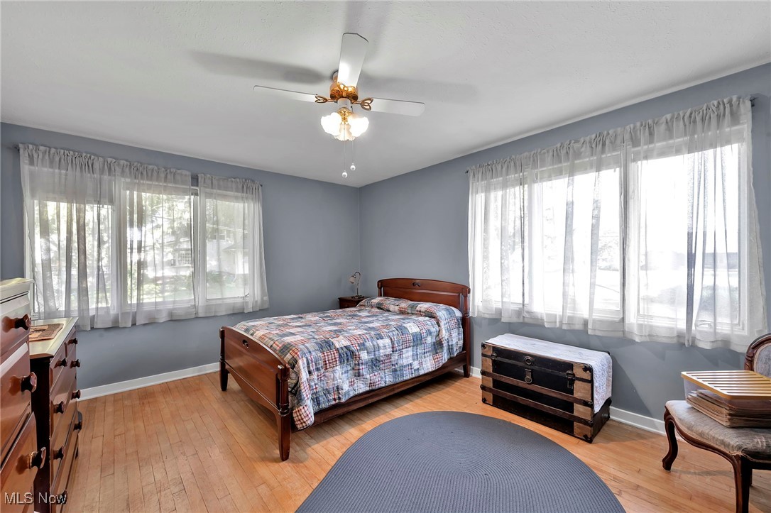 25915 Kennedy Ridge Road North Olmsted, OH 44070 - Photo 22 of 48 Bedroom featuring light wood-type flooring and ceiling fan