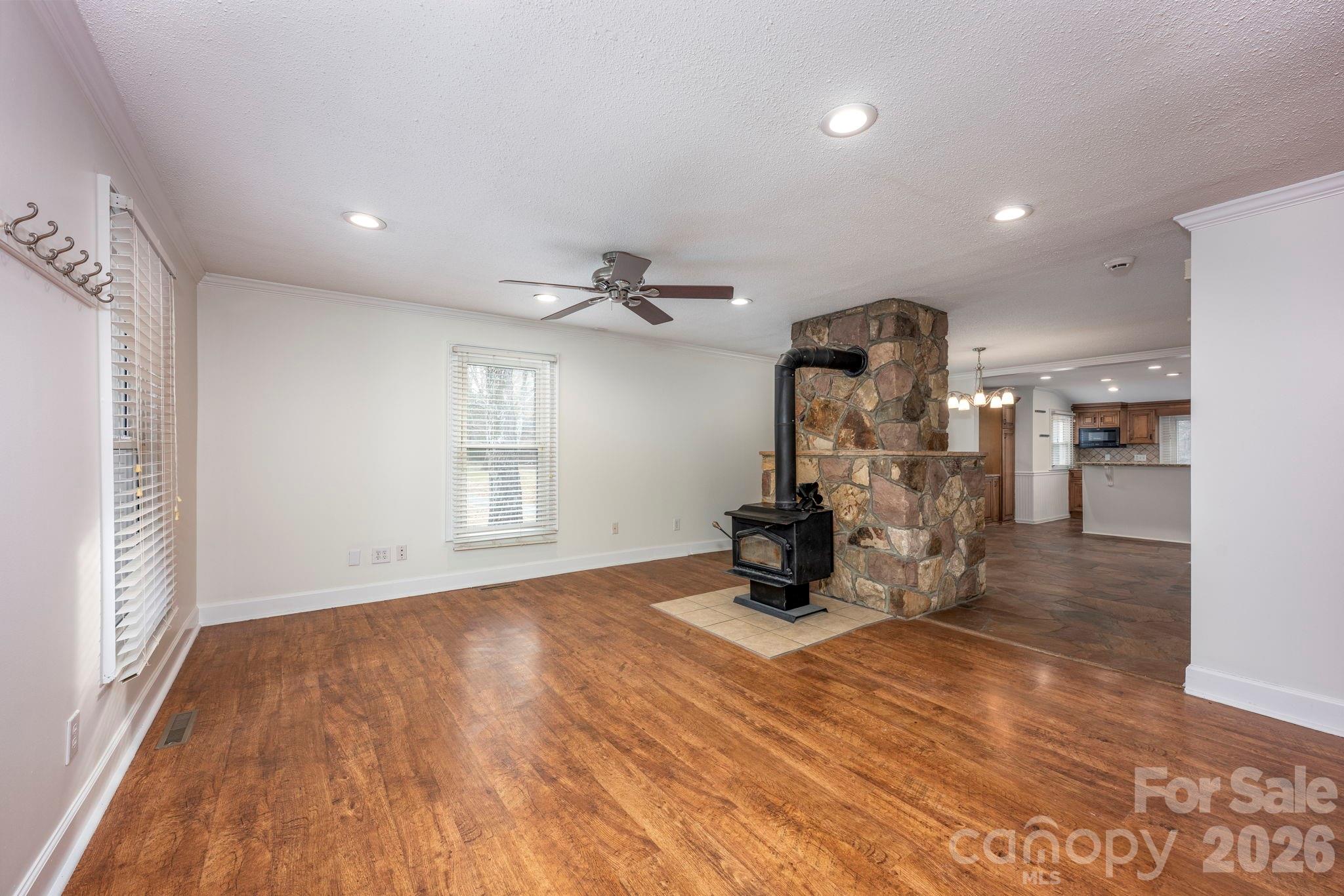 495 Chalk Maple Road China Grove, NC 28023 - Photo 20 of 48 a view of a living room a kitchen and a wooden floor