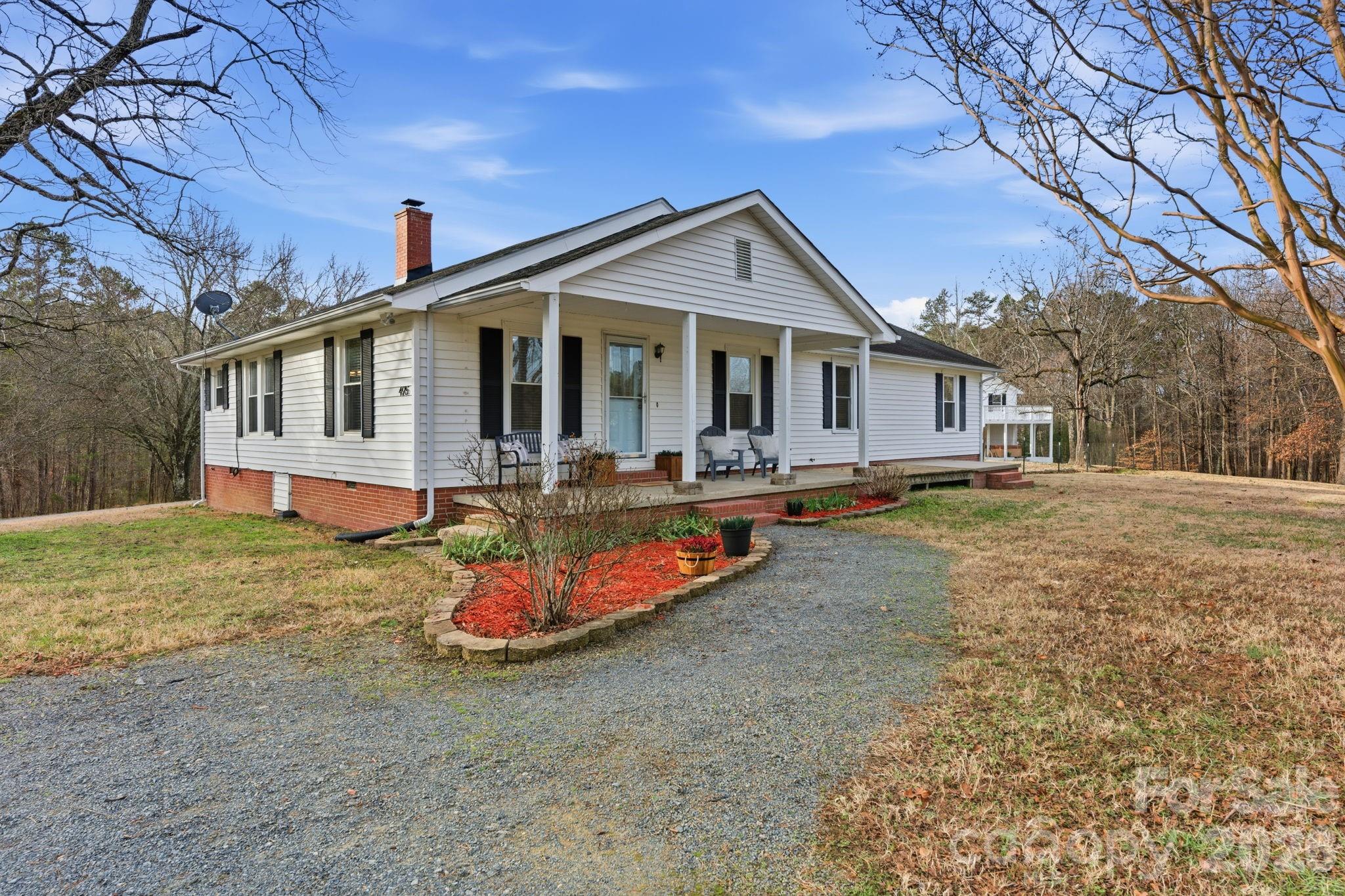 495 Chalk Maple Road China Grove, NC 28023 - Photo 2 of 48 a front view of a house with a yard