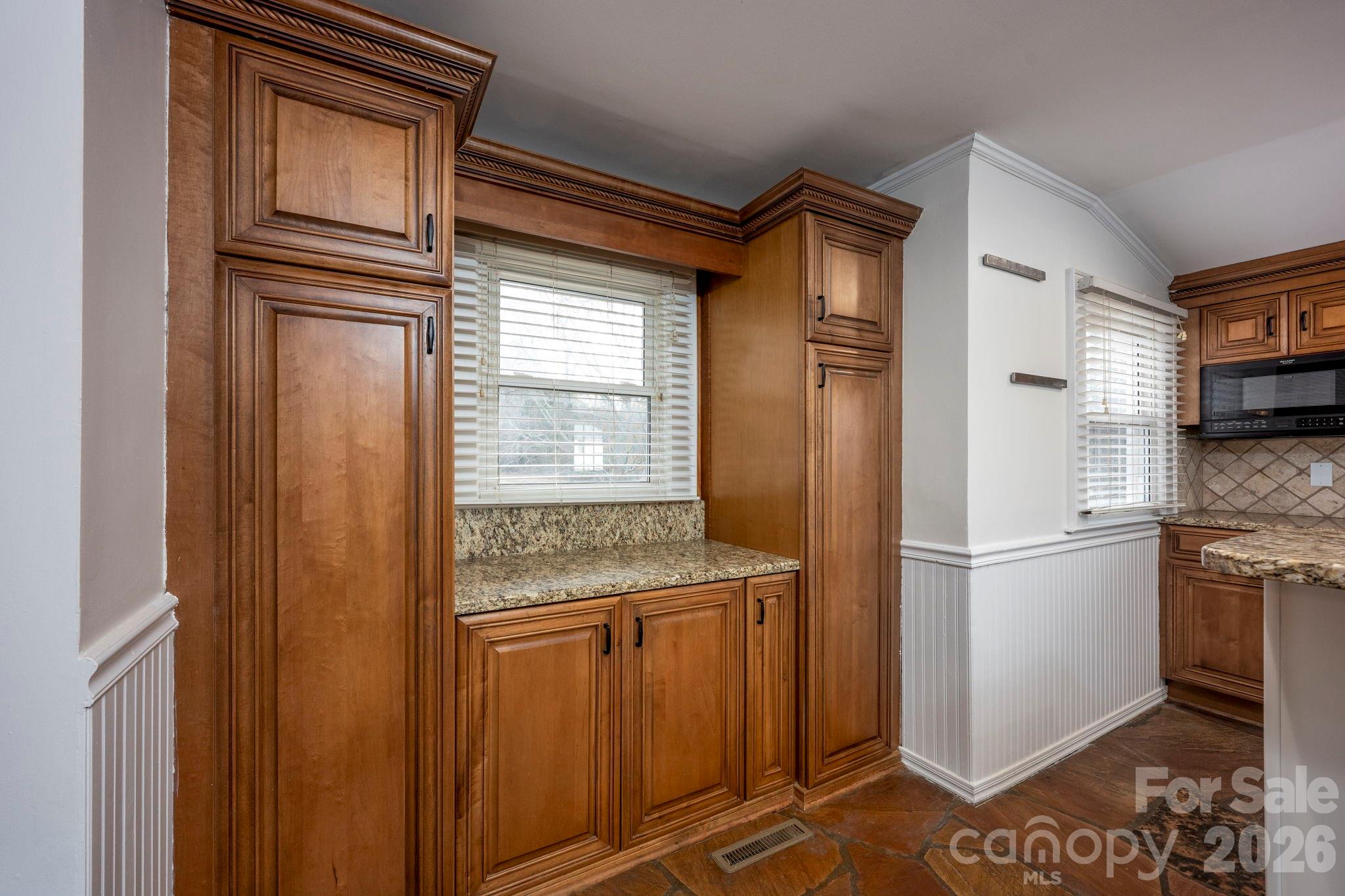 495 Chalk Maple Road China Grove, NC 28023 - Photo 27 of 48 a kitchen with stainless steel appliances granite countertop a refrigerator and a sink