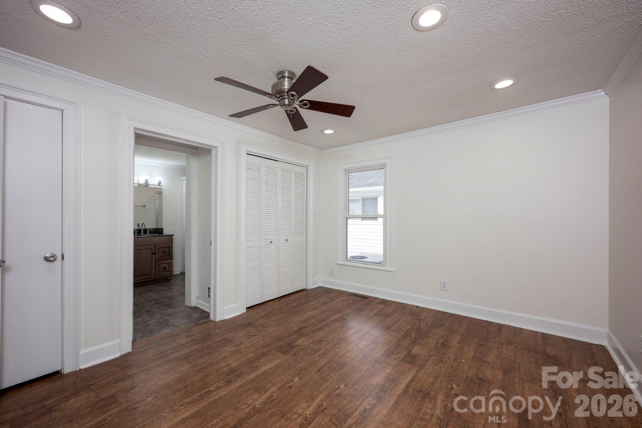 495 Chalk Maple Road China Grove, NC 28023 - Photo 28 of 48 a view of empty room with wooden floor and window