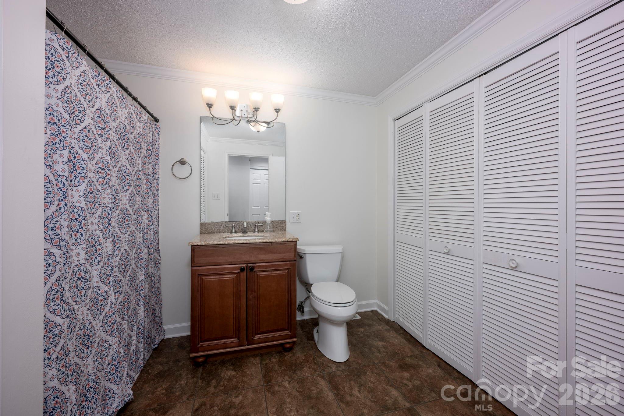 495 Chalk Maple Road China Grove, NC 28023 - Photo 32 of 48 a bathroom with a granite countertop toilet and a sink