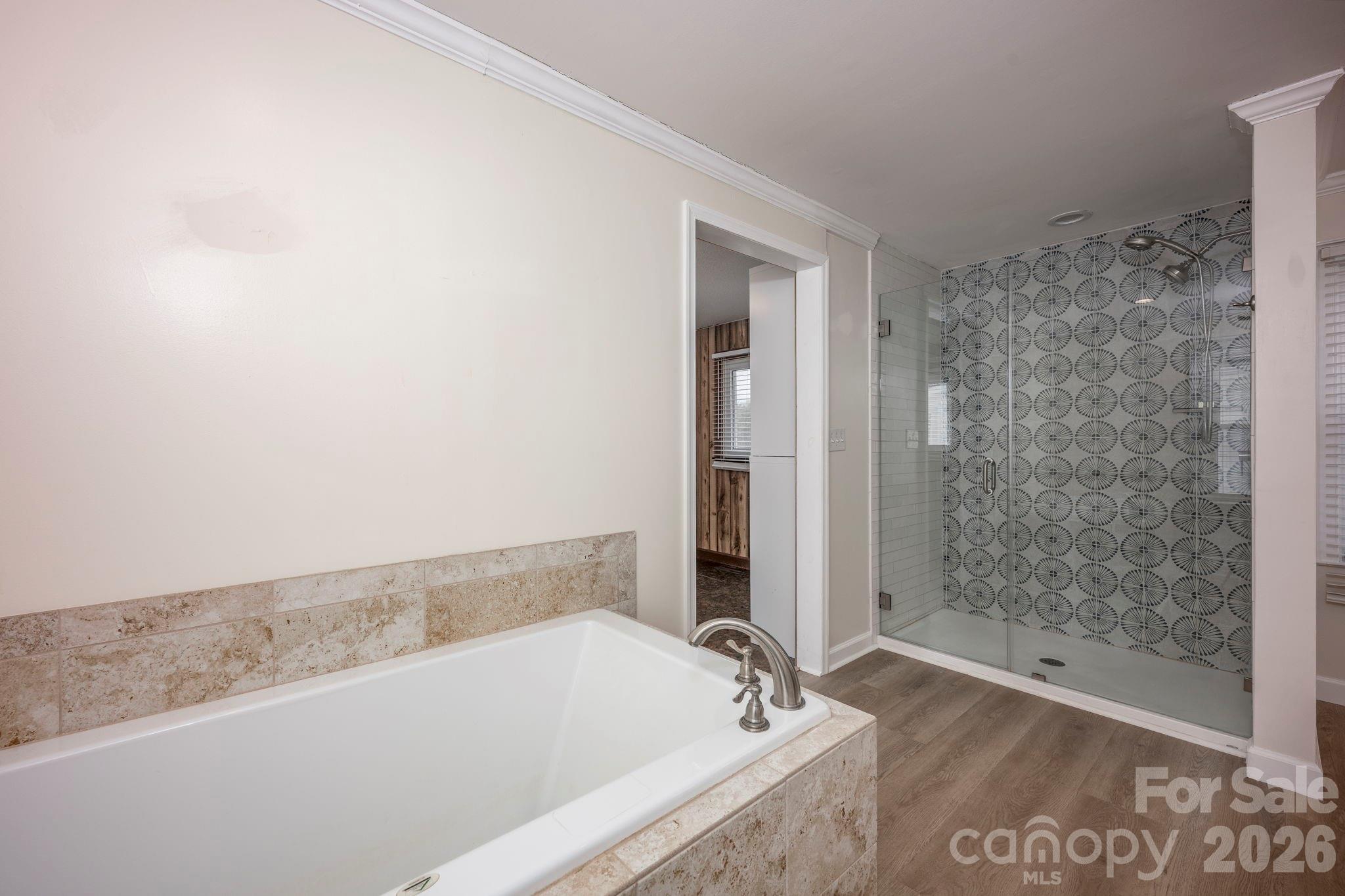 495 Chalk Maple Road China Grove, NC 28023 - Photo 35 of 48 a bathroom with a bathtub and shower