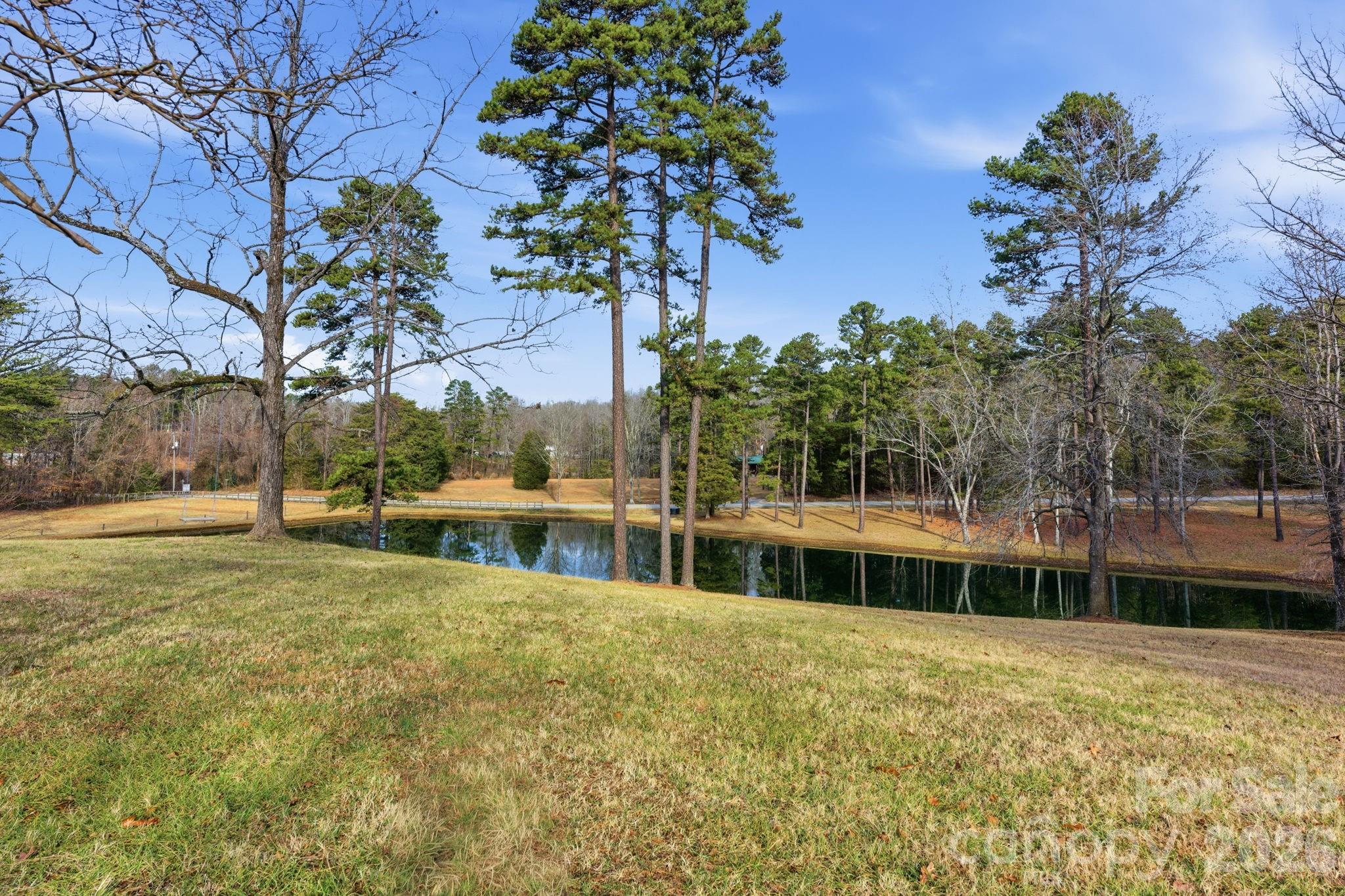 495 Chalk Maple Road China Grove, NC 28023 - Photo 5 of 48 a house with a large tree in front of it