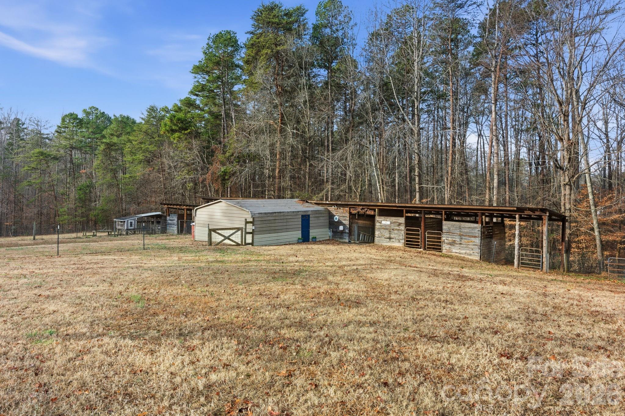 495 Chalk Maple Road China Grove, NC 28023 - Photo 9 of 48 a front view of a house with a yard