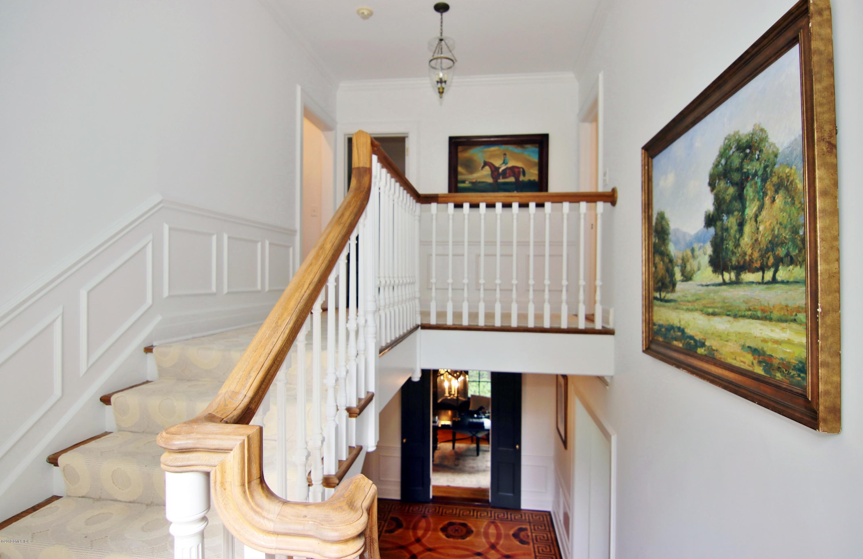 19 Andrews Road Greenwich, CT 06830 - Photo 17 of 35 a view of entryway livingroom and hall with wooden floor