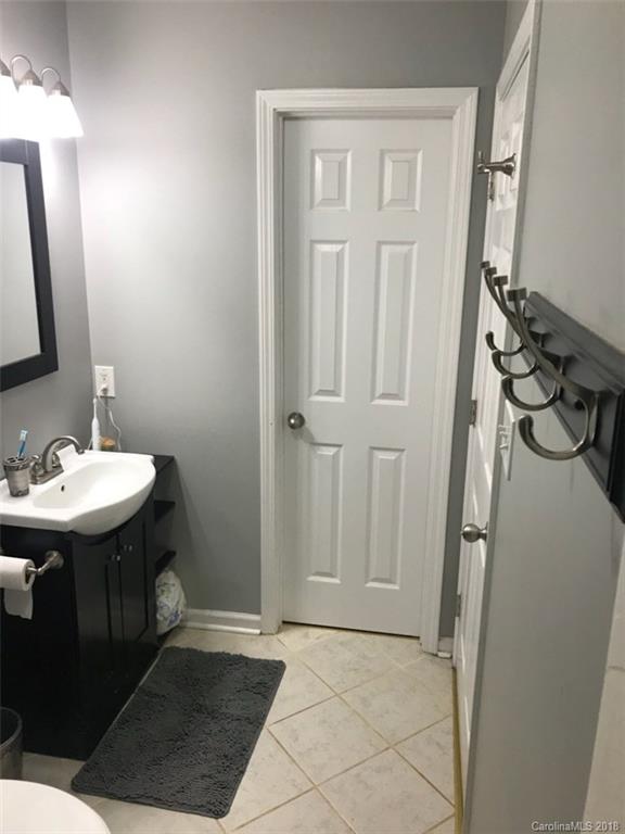 4741 Kemp Dellinger Road Maiden, NC 28650 - Photo 17 of 21 a bathroom with a sink a toilet a mirror and shower