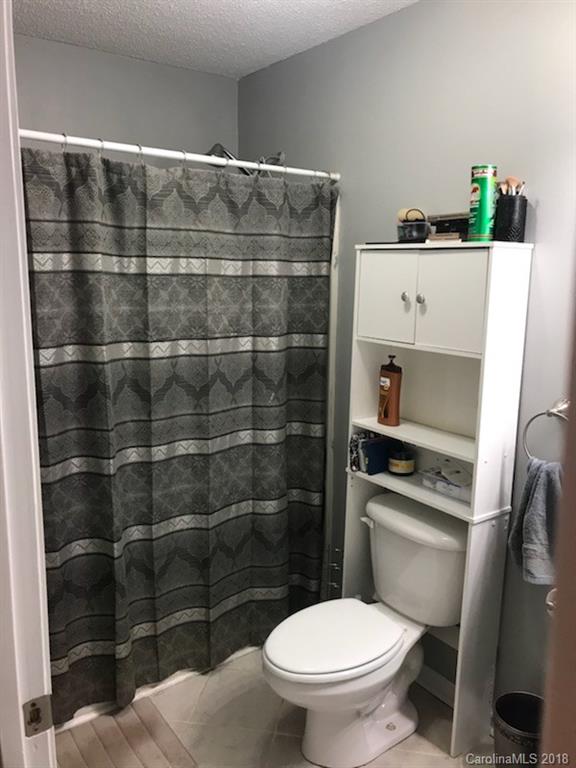 4741 Kemp Dellinger Road Maiden, NC 28650 - Photo 18 of 21 a bathroom with a toilet and a shower