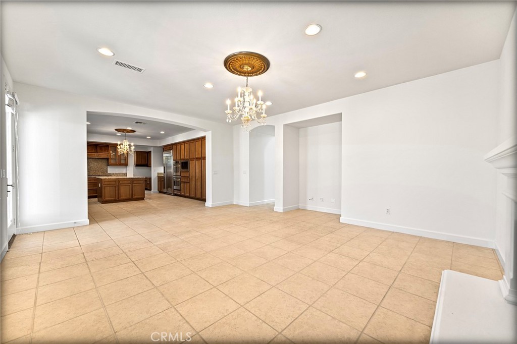 6360 Day Lily Court Rancho Cucamonga, CA 91737 - Photo 16 of 56 a view of an empty room with a kitchen