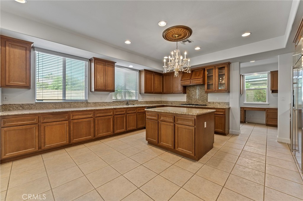 6360 Day Lily Court Rancho Cucamonga, CA 91737 - Photo 18 of 56 a kitchen with a sink counter top space appliances and cabinets