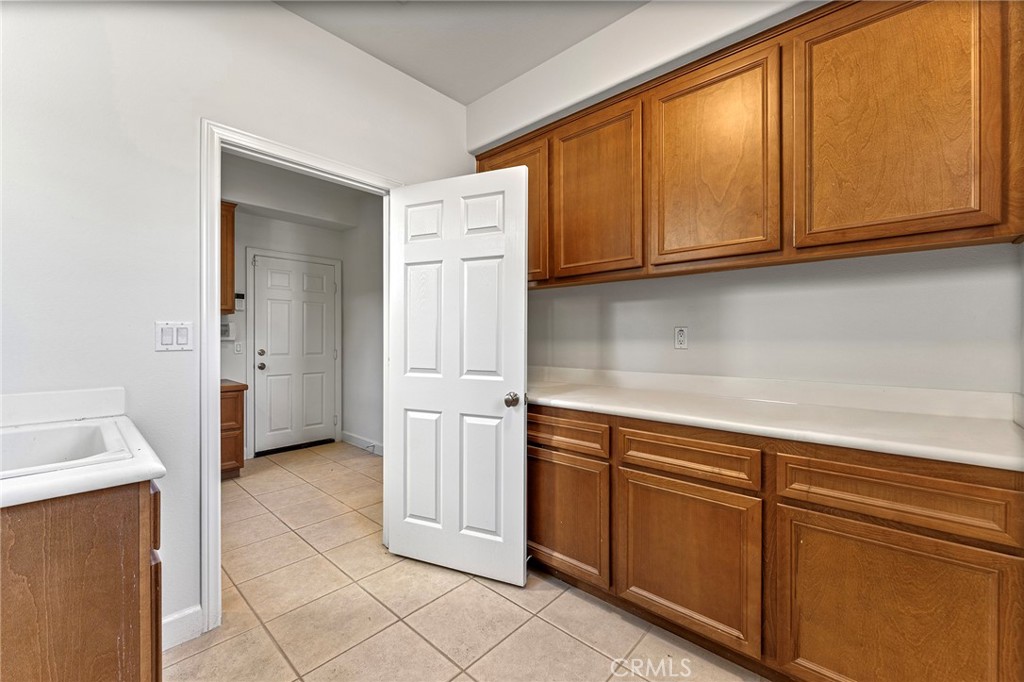6360 Day Lily Court Rancho Cucamonga, CA 91737 - Photo 23 of 56 a kitchen with stainless steel appliances granite countertop a refrigerator and cabinets