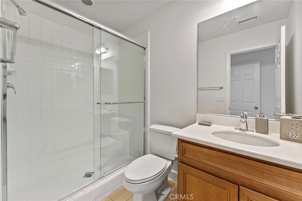 6360 Day Lily Court Rancho Cucamonga, CA 91737 - Photo 26 of 56 a bathroom with a sink toilet and shower