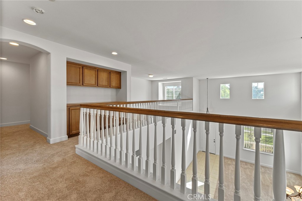 6360 Day Lily Court Rancho Cucamonga, CA 91737 - Photo 28 of 56 a view of a hallway with windows
