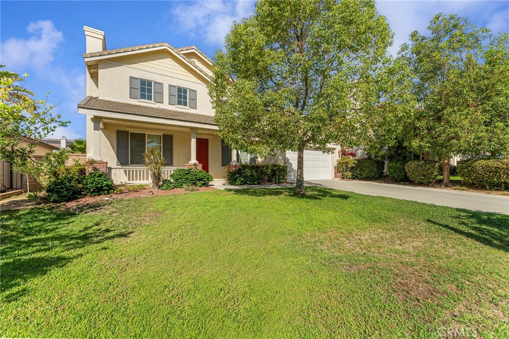 6360 Day Lily Court Rancho Cucamonga, CA 91737 - Photo 3 of 56 a front view of house with yard and green space