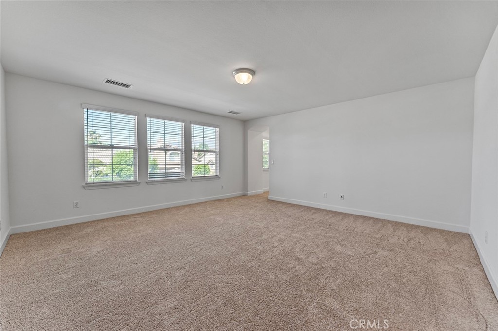 6360 Day Lily Court Rancho Cucamonga, CA 91737 - Photo 31 of 56 an empty room with windows