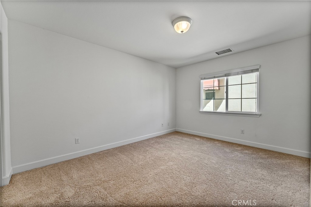 6360 Day Lily Court Rancho Cucamonga, CA 91737 - Photo 40 of 56 an empty room with windows