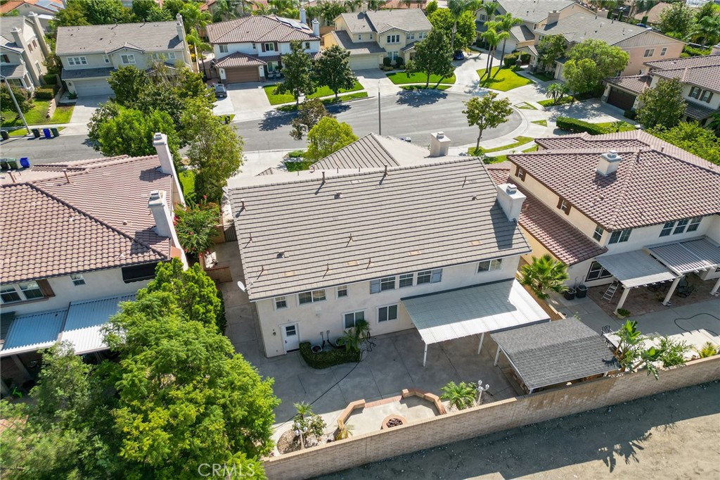 6360 Day Lily Court Rancho Cucamonga, CA 91737 - Photo 4 of 56 an aerial view of a house with a yard and potted plants