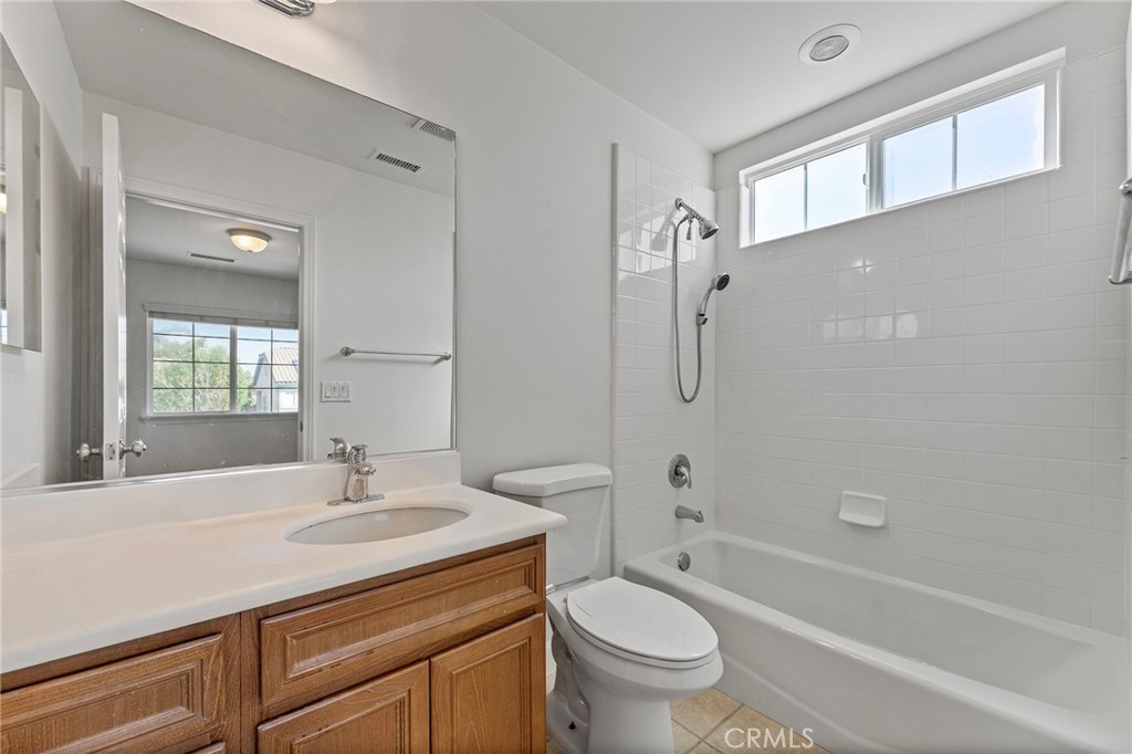 6360 Day Lily Court Rancho Cucamonga, CA 91737 - Photo 45 of 56 a bathroom with a sink a toilet and shower