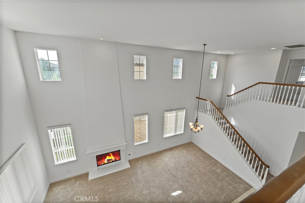 6360 Day Lily Court Rancho Cucamonga, CA 91737 - Photo 47 of 56 a living room with furniture and a window
