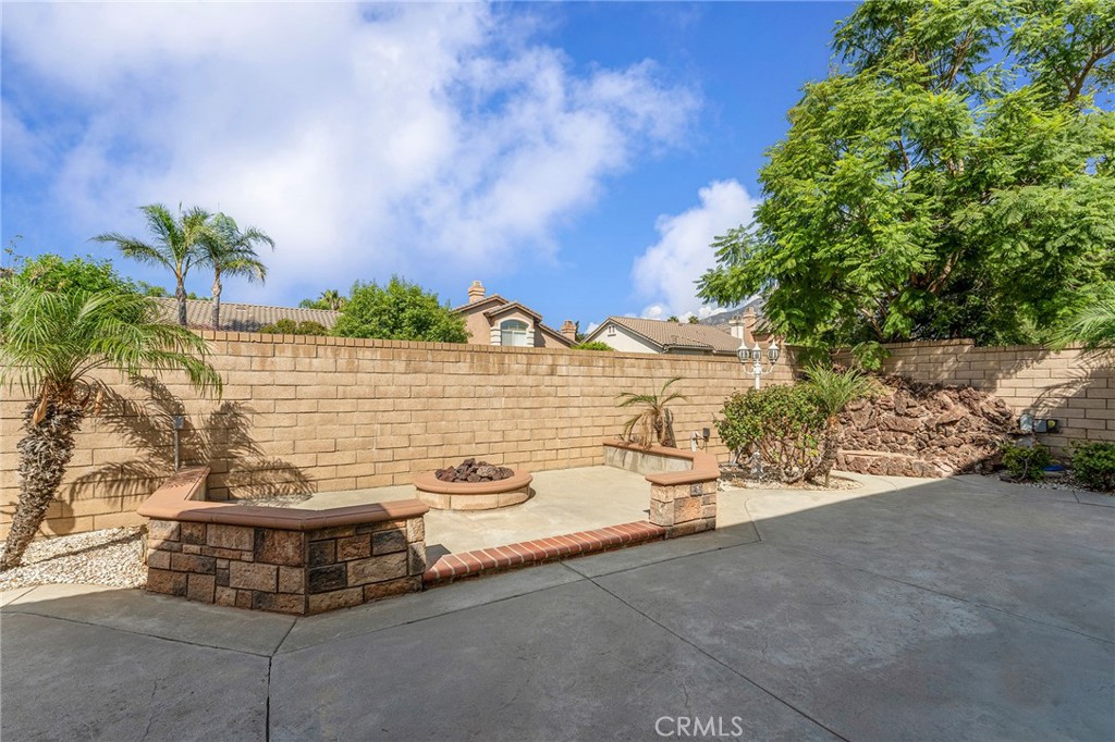 6360 Day Lily Court Rancho Cucamonga, CA 91737 - Photo 51 of 56 a view of a terrace with a bench and potted plants