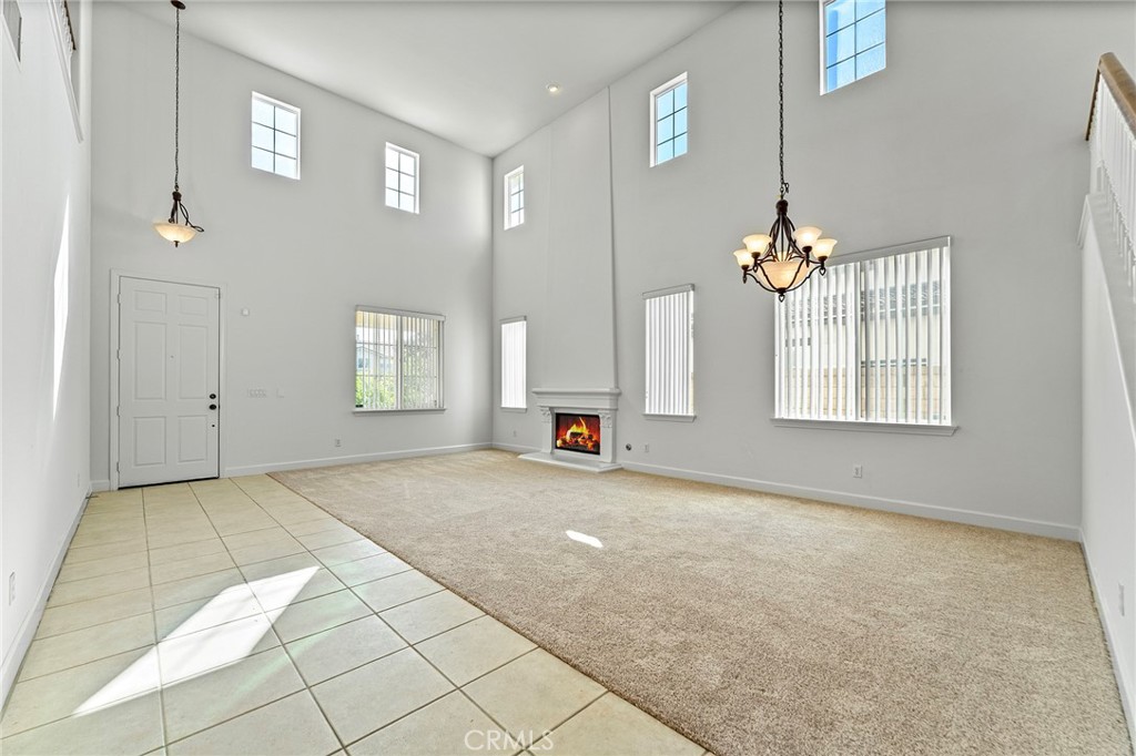 6360 Day Lily Court Rancho Cucamonga, CA 91737 - Photo 9 of 56 an empty room with windows and fireplace