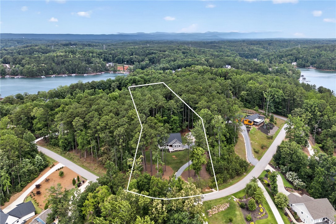 2024 Retreat Pointe Road West Union, SC 29696 - Photo 2 of 43 Overlook Lake Keowee from this serene, wooded property, offering both seclusion and water views.