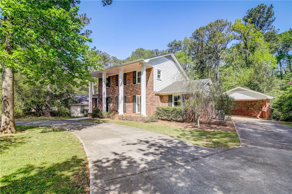 3282 David Road Atlanta, GA 30341 - Photo 1 of 1 a front view of a house with a yard