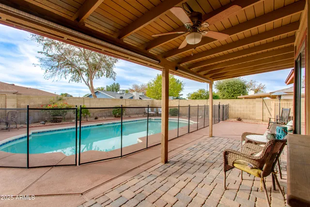a view of a swimming pool with a lounge chairs