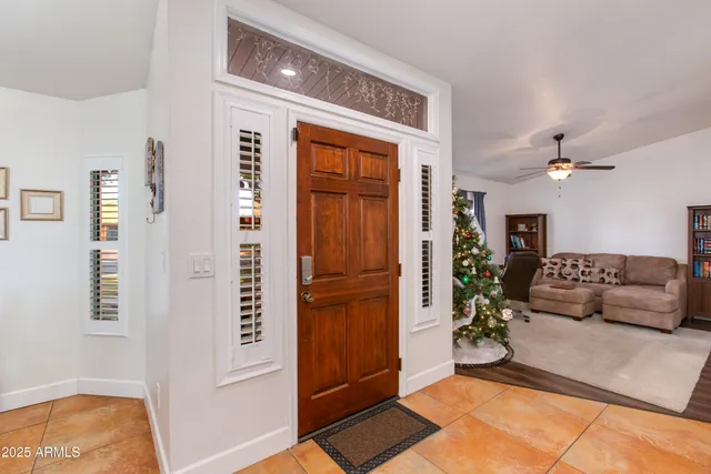 a living room with furniture workspace and a window