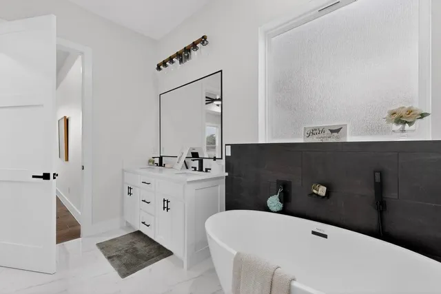 a bedroom with a bed and glass door